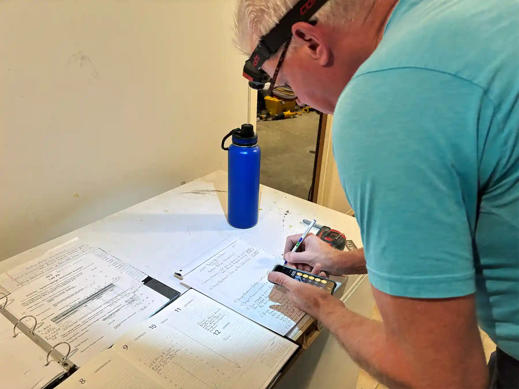 Radon mitigation specialist Greg Wheaton C-NRPP calculating the size of the system to install.